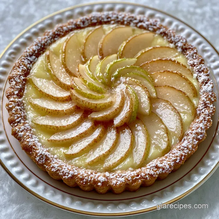 A thin slice of pale yellow custard tart on a white ceramic plate, drizzled with syrup and a sprig of fresh mint.