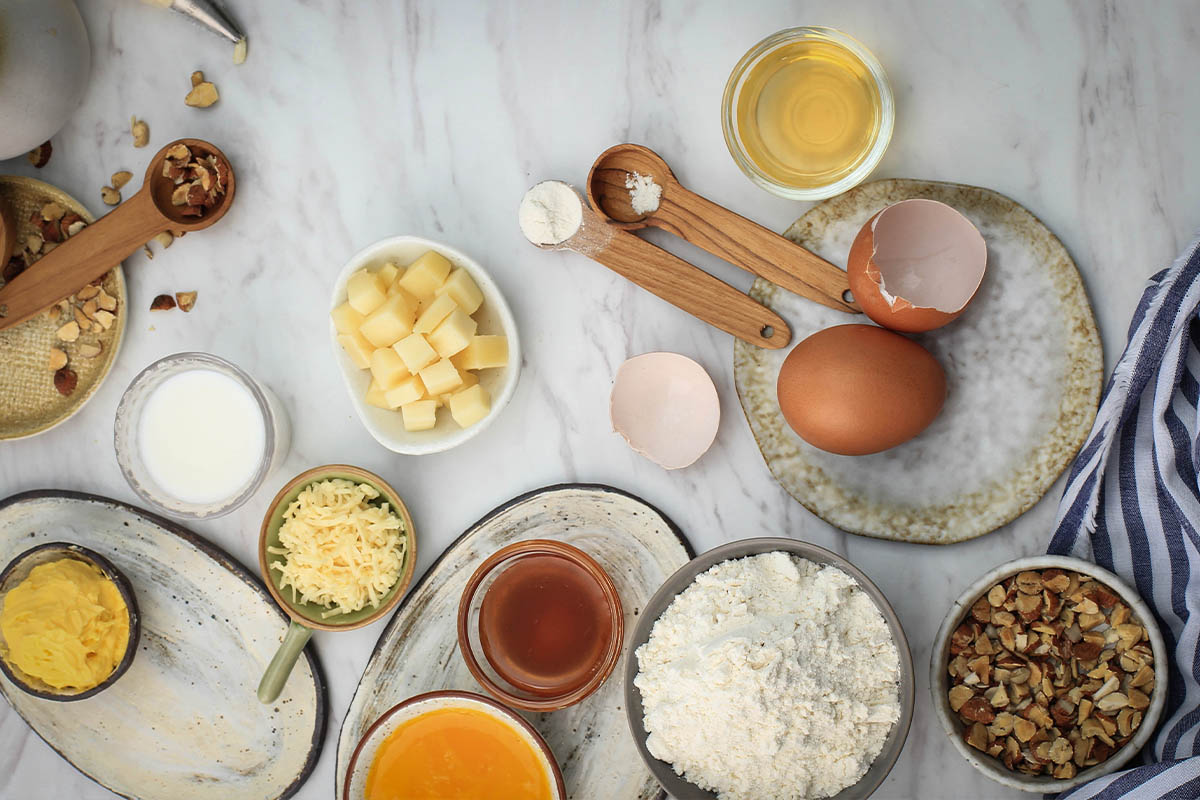 Ingredients for homemade milk cookies on a kitchen counter.