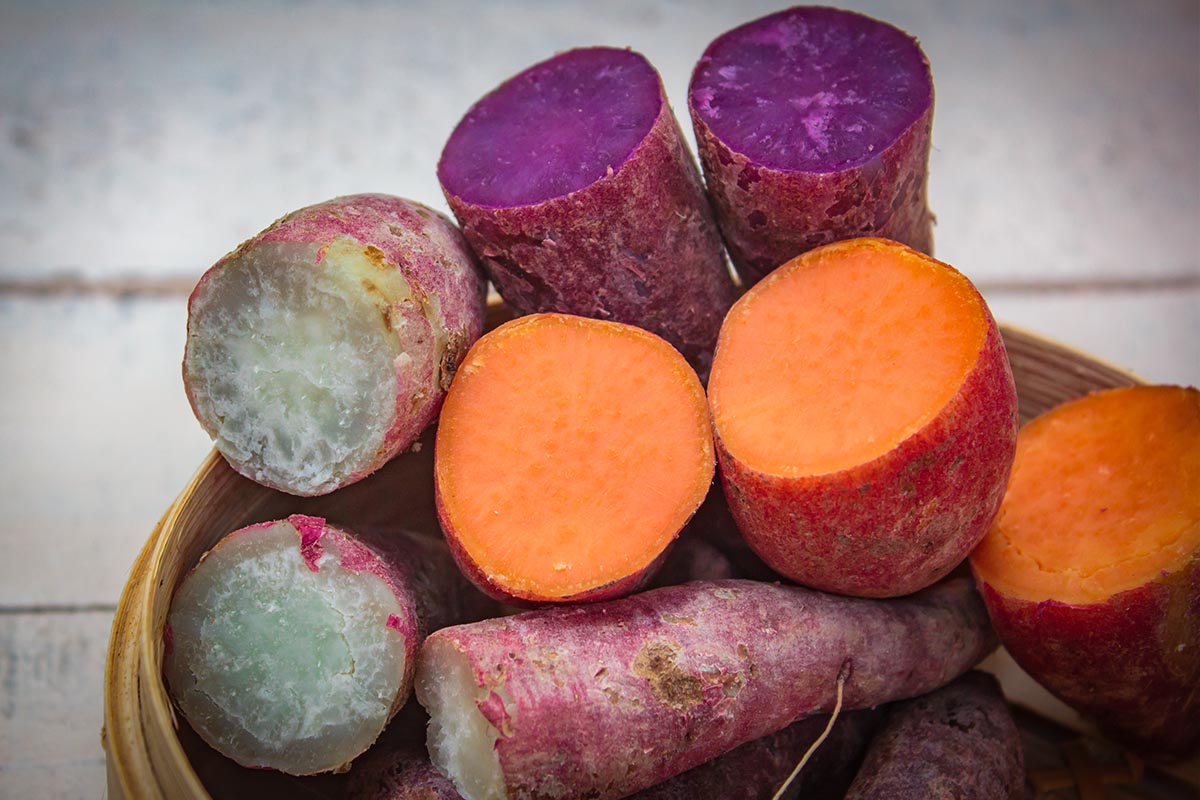 A close-up of roasted purple sweet potatoes highlighting their vibrant color and unique flavor