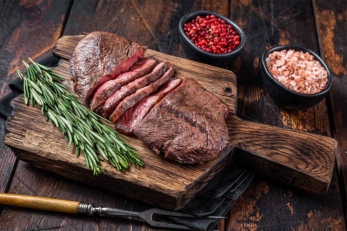 Grilled bavette steak sliced against the grain, served with roasted vegetables