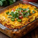 Cheesy walking taco casserole with chips and toppings